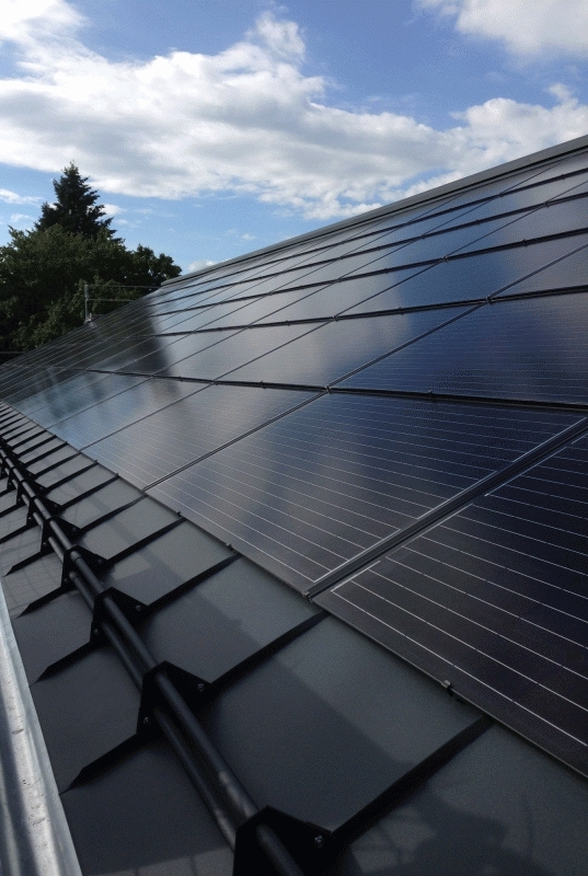 Integrated solar roof tiles on residential building